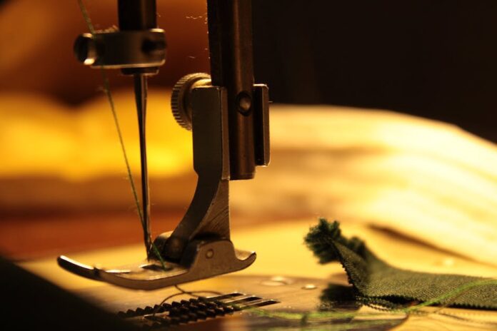 bernina - Detailed view of a sewing machine needle stitching fabric, highlighting craftsmanship.